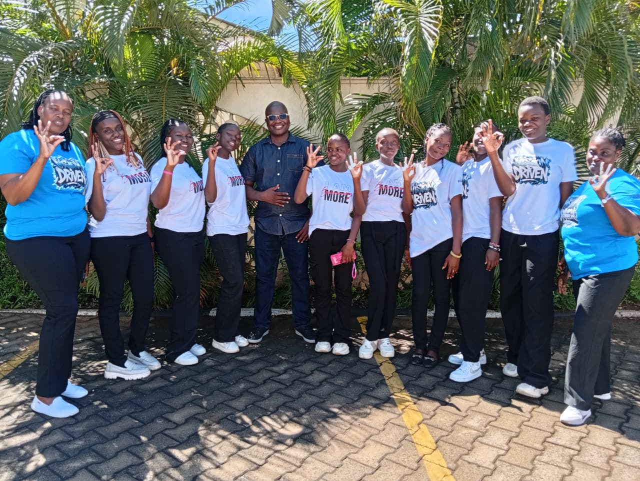 Act Nicely Production Club team joins Kenneth during the official book launch event held in Kisumu City venue today